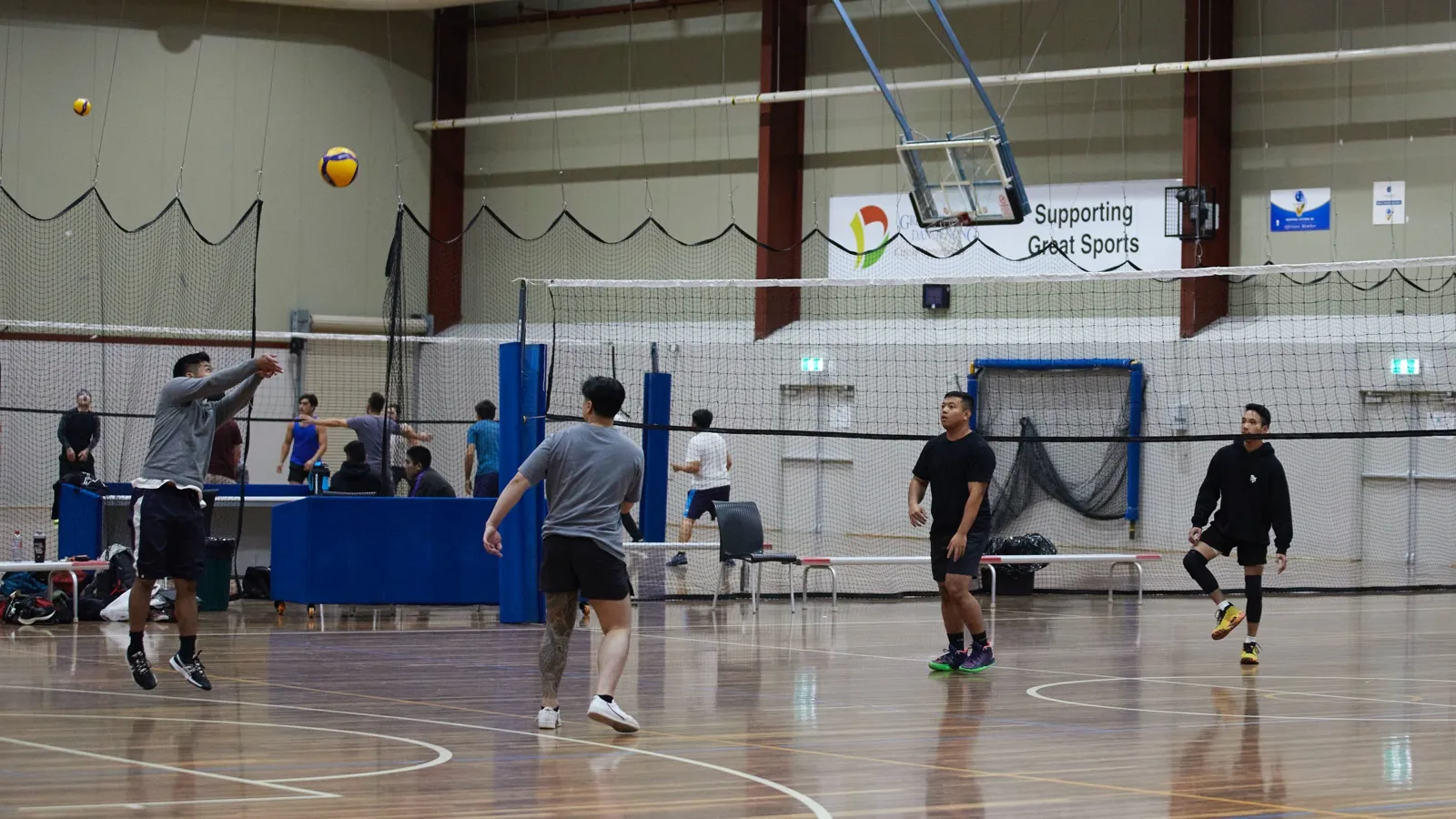 Group of male Volleyball players playing indoors