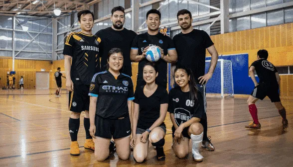 A team of Futsal players poses for a picture