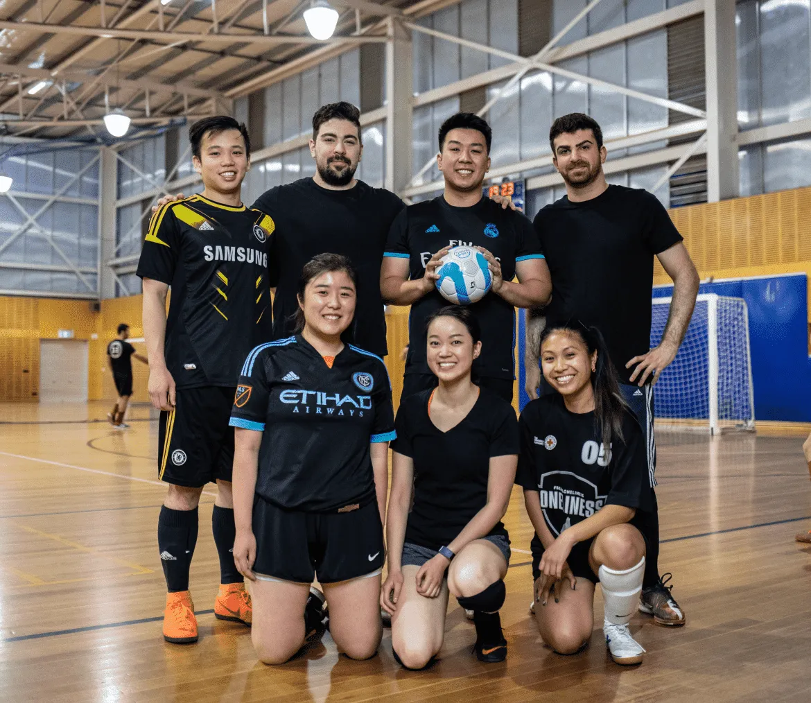 A team of Futsal players posing for a picture