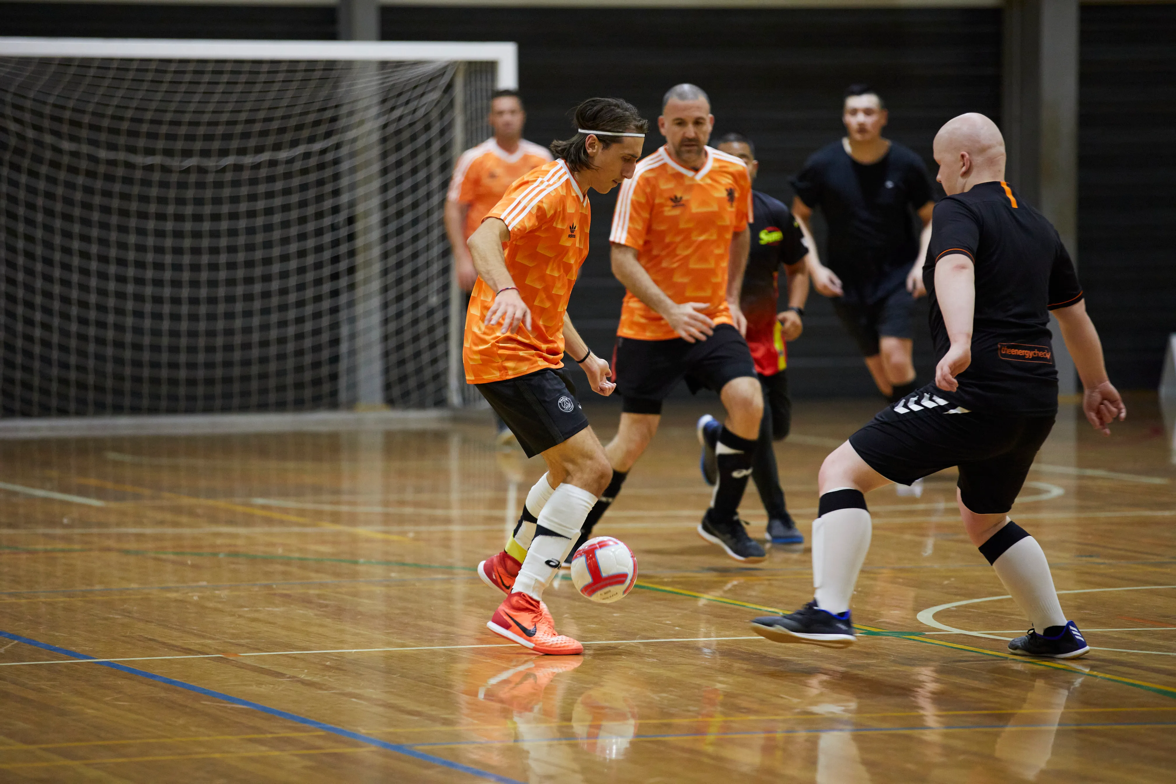A team of Futsal players posing for a picture