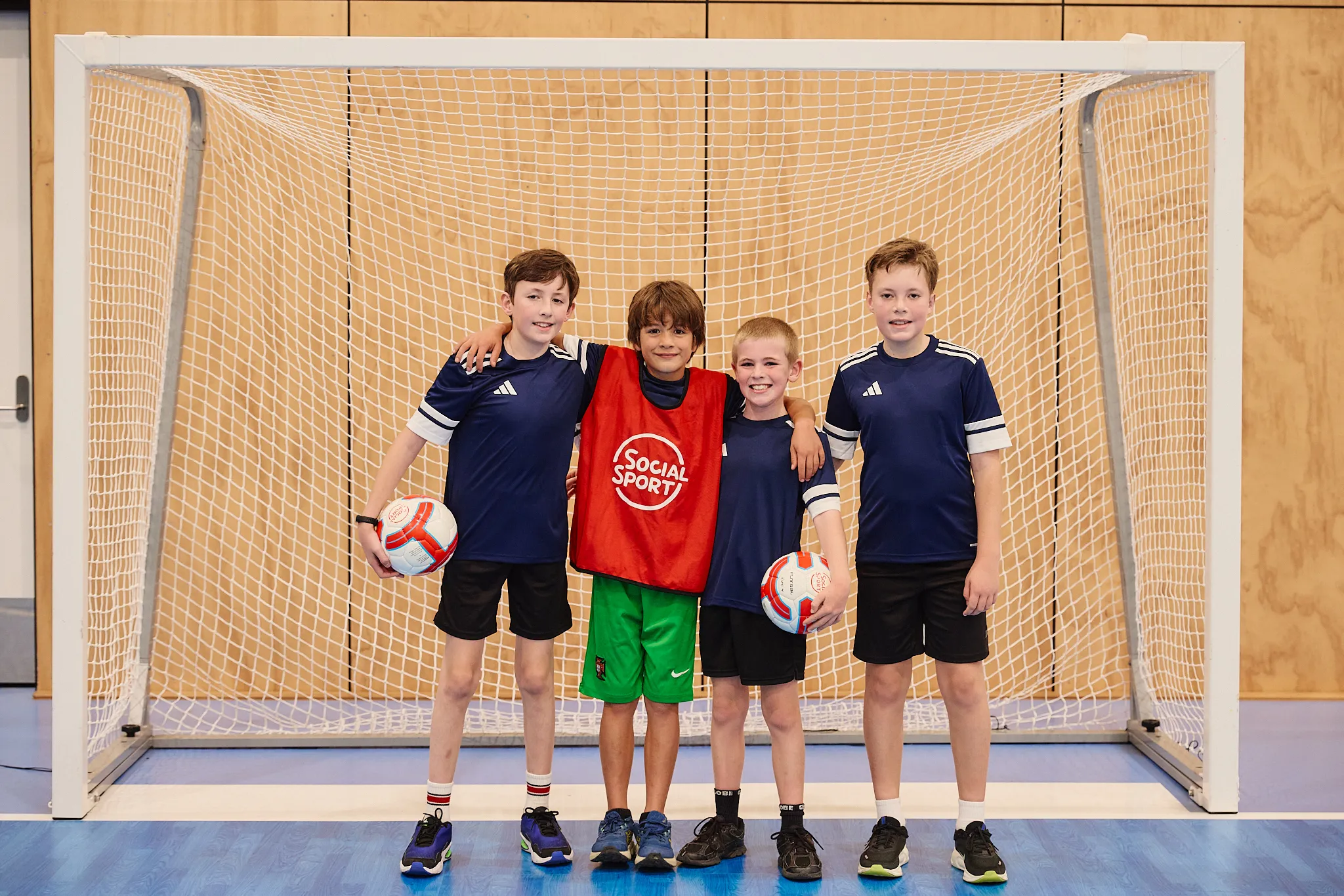 A team of Futsal players posing for a picture