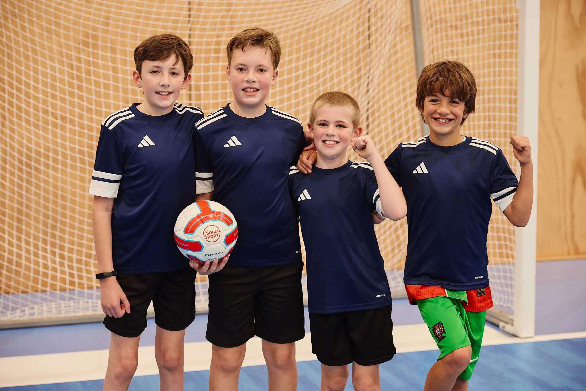 A team of Futsal players posing for a picture