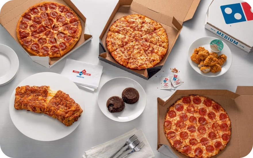 Three pizzas and a couple sides from Domino's, one of Canada's top franchises in 2026.