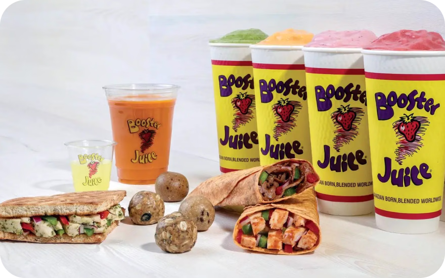Booster Juice smoothie in a branded cup made with fruit and blended ingredients.