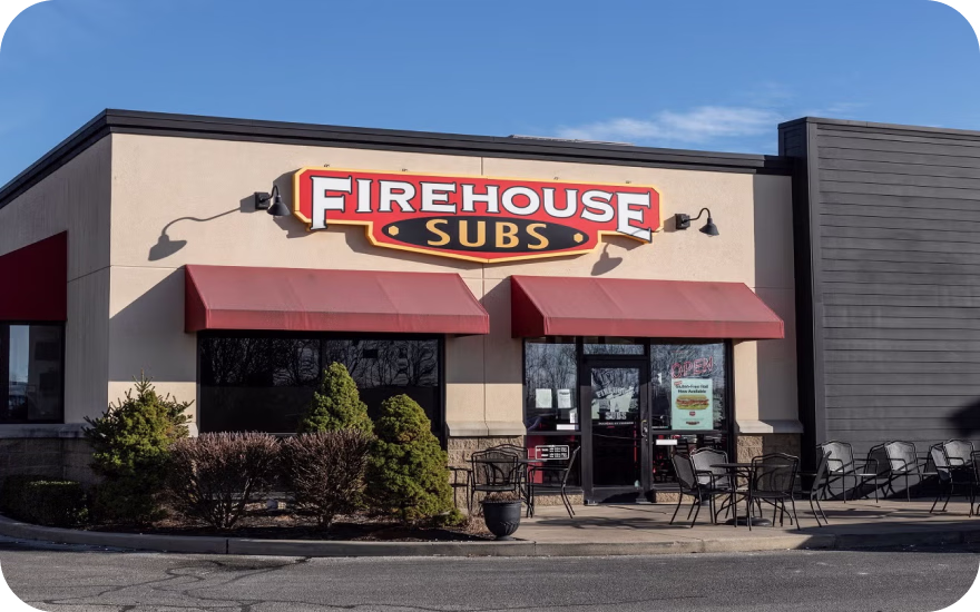 Firehouse Subs storefront with firefighter-themed branding and red signage from a leading US sandwich franchise.