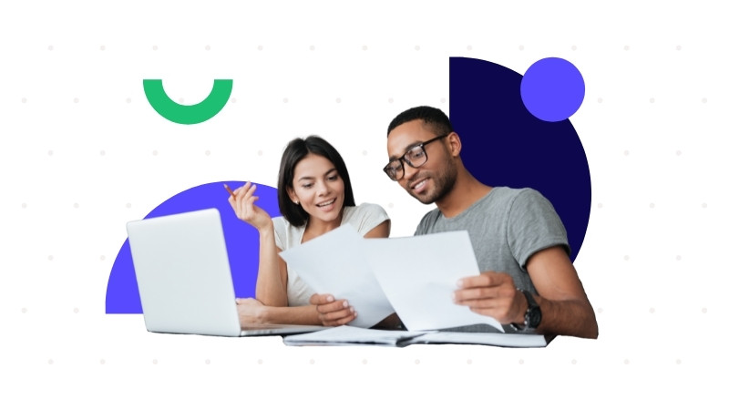 Two restaurant employees are reviewing reports thanks to restaurant tech.