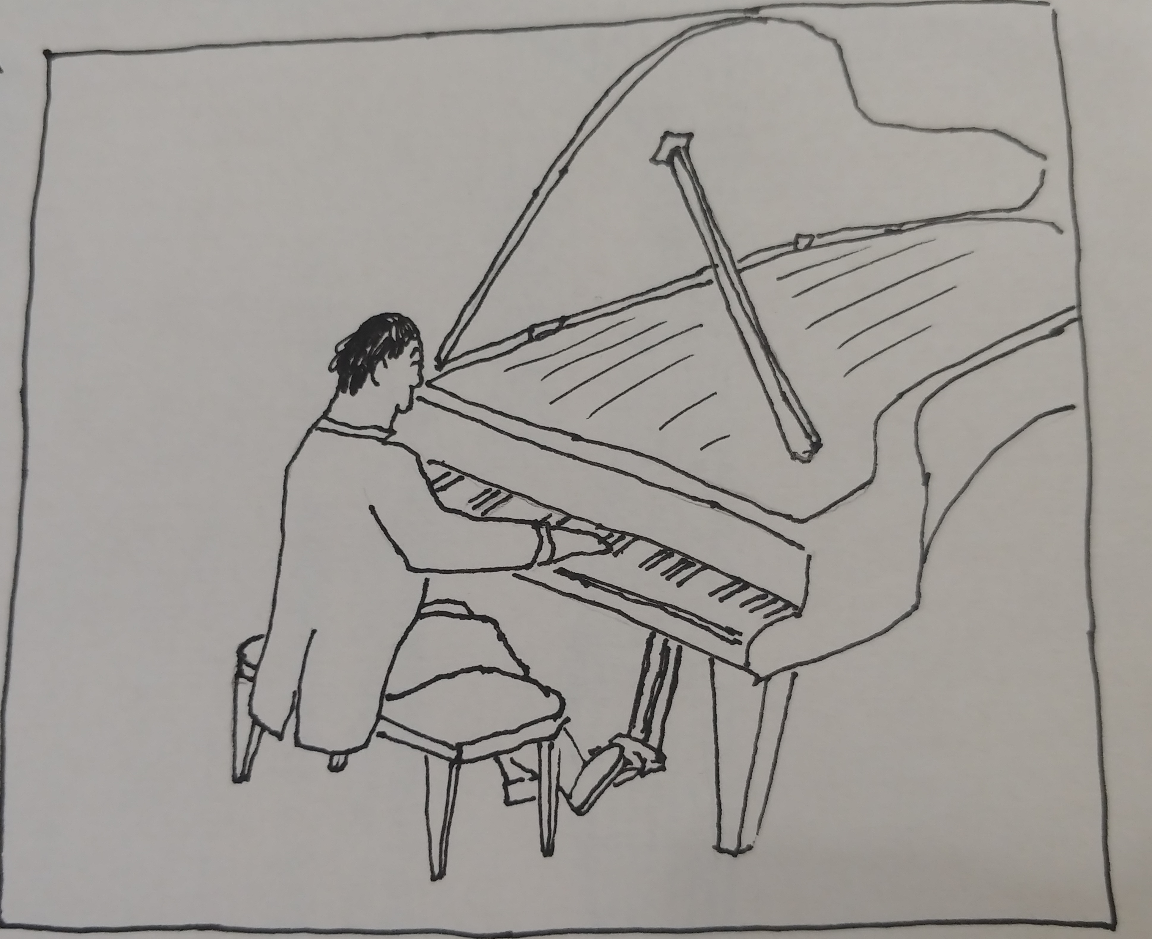 Adult junior in a tuxedo playing a grand piano