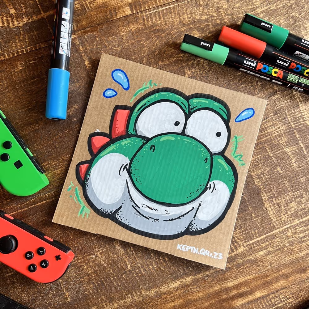 Ein Kunstwerk von Julian Reichel auf recyceltem Pizzakarton es zeigt einen dicken Yoshi