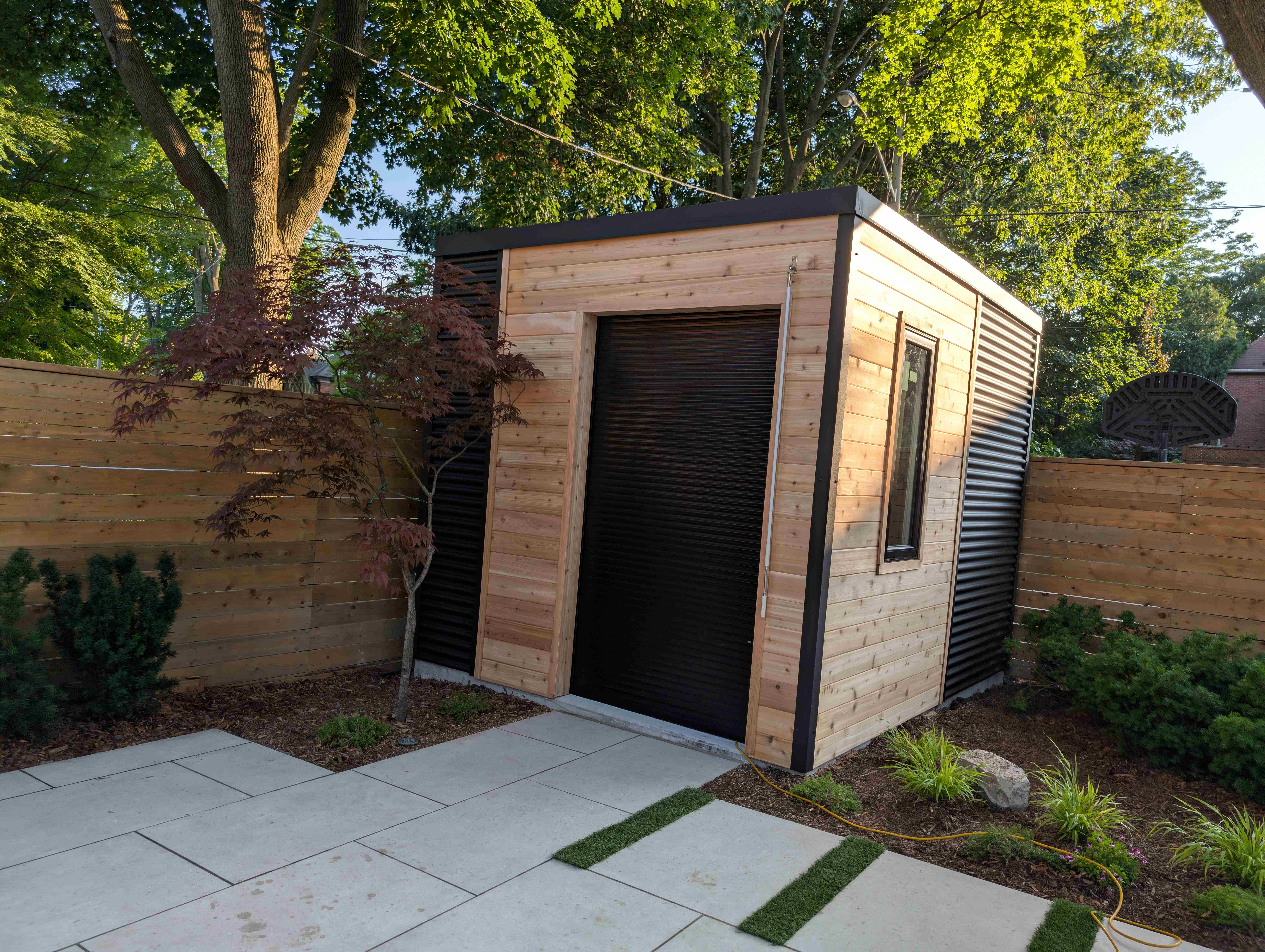 A modern designed maintenance free shed with steel siding for storage
