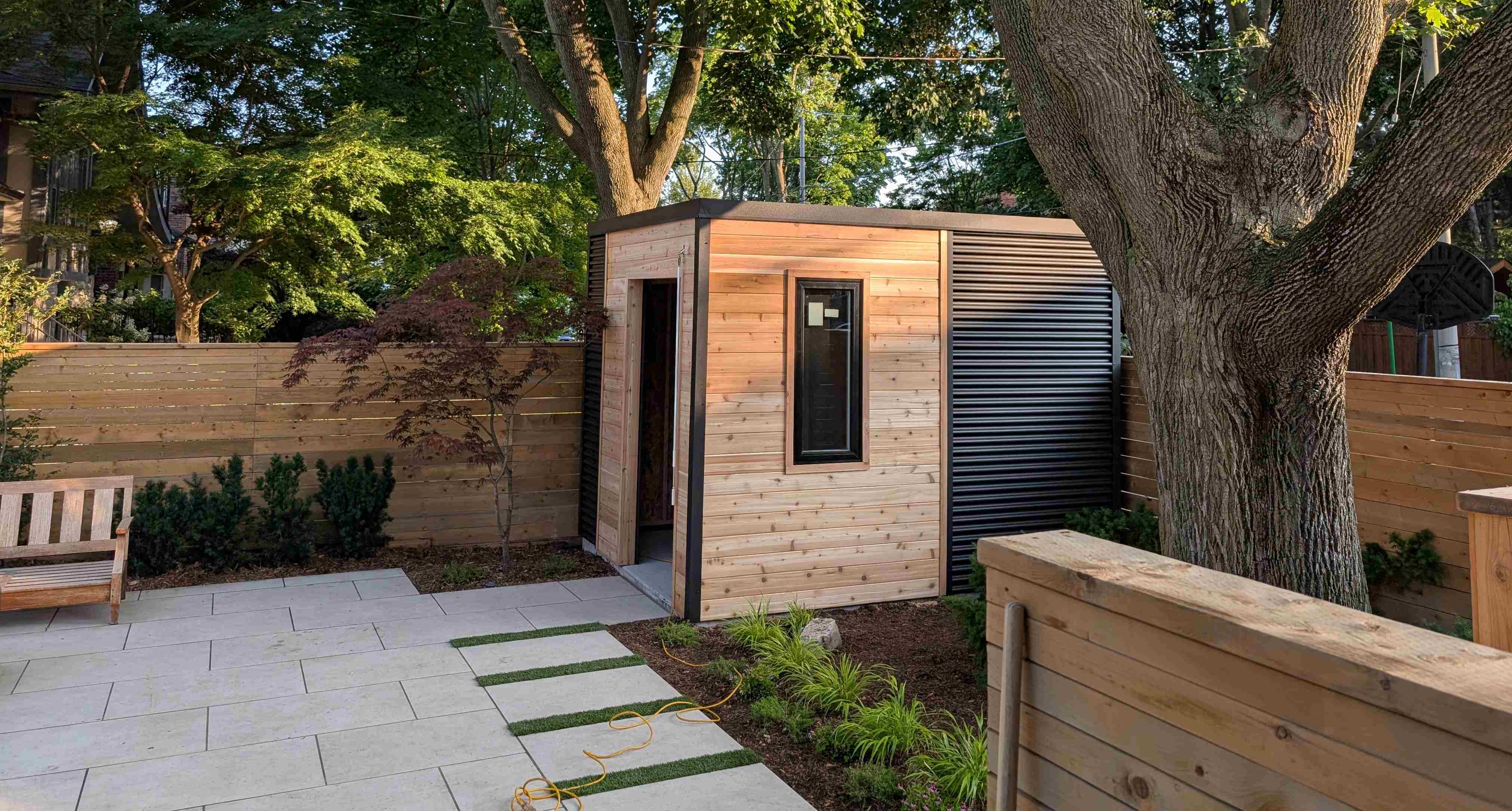 Bike and utility Shed with rollup door and casement window. maintenance free design