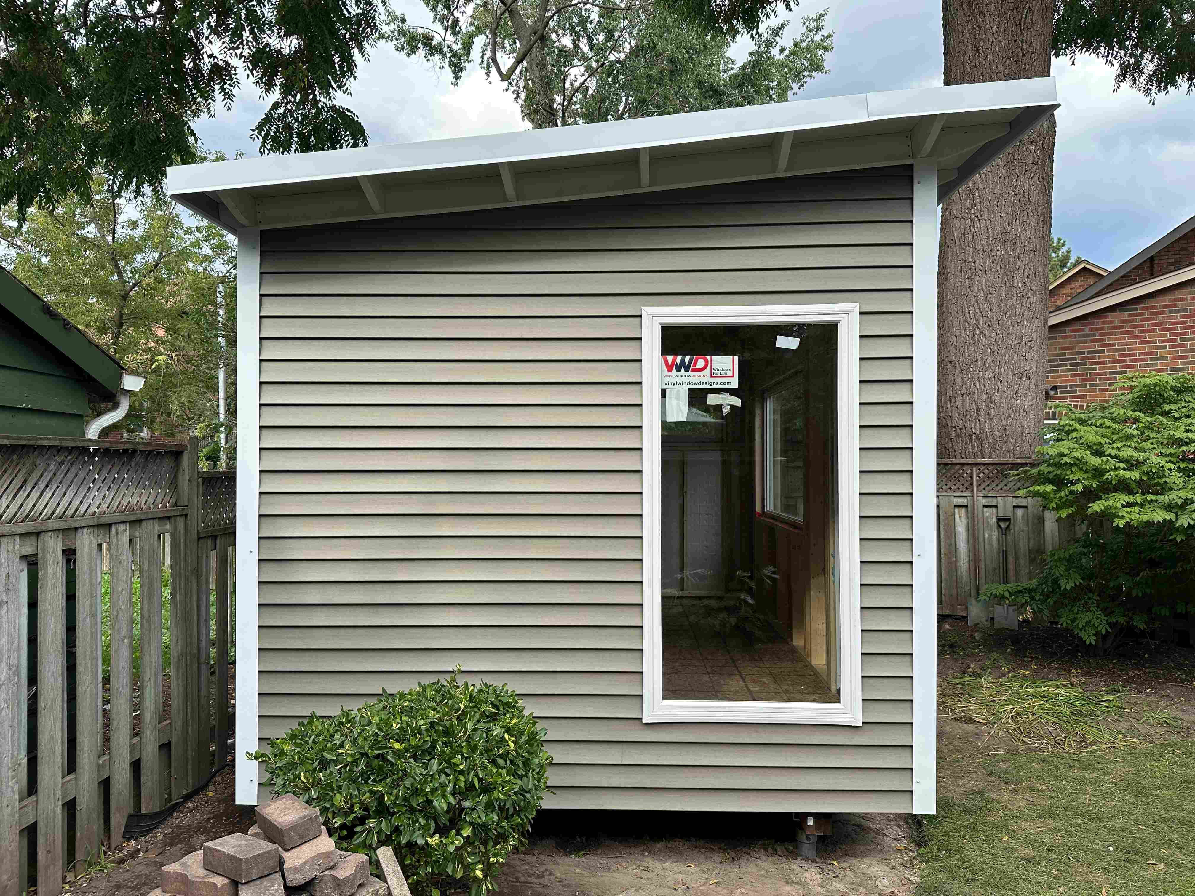 16x10 backyard studio positioned in a Scarborough Ontario backyard garden
