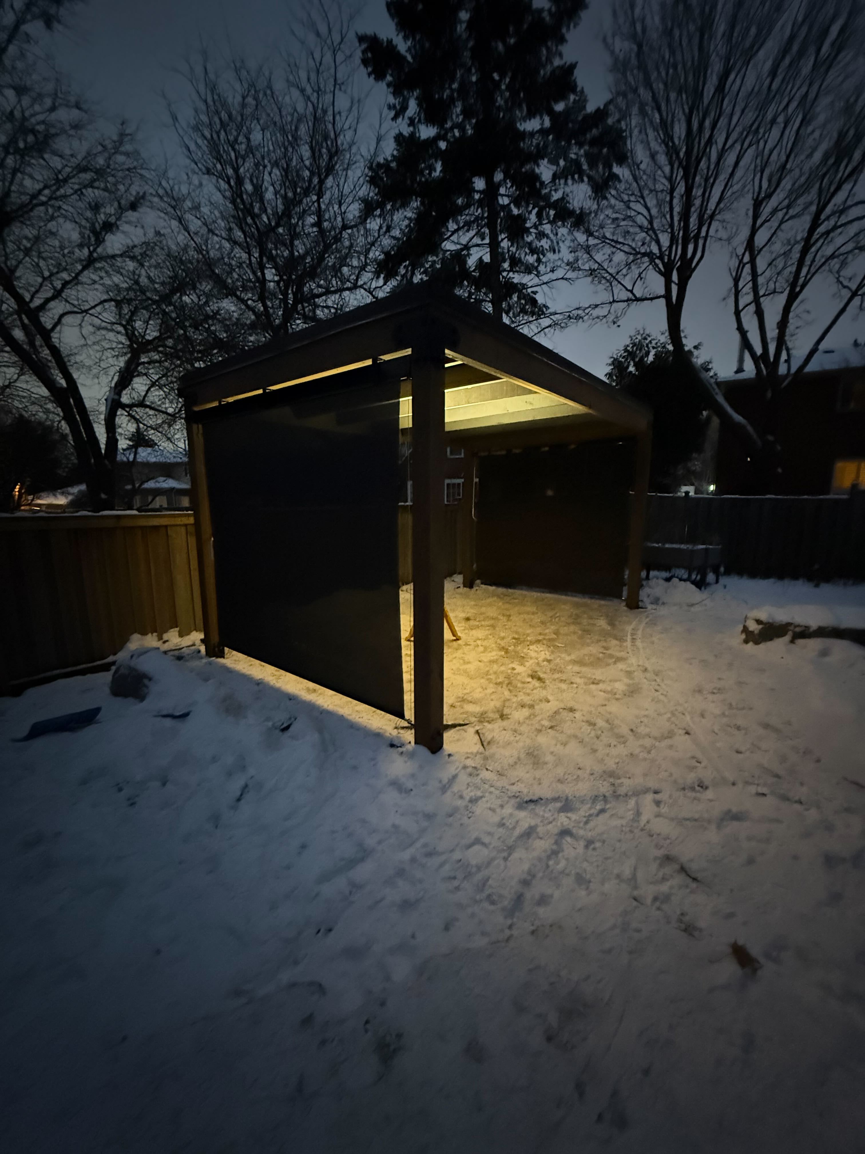 16x10 Douglas Fir pergola with black steel trim and cable-drop screens in Markham Ontario, installed by Backyard Escape Studios.