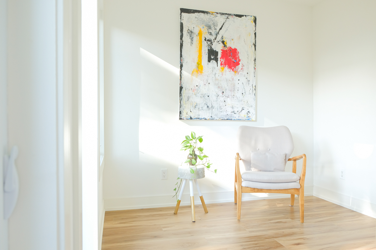 Bright interior of 12x9 Backyard Office Studio in Toronto Ontario showing natural light, hardwood floors, and open layout built by Backyard Escape Studios.