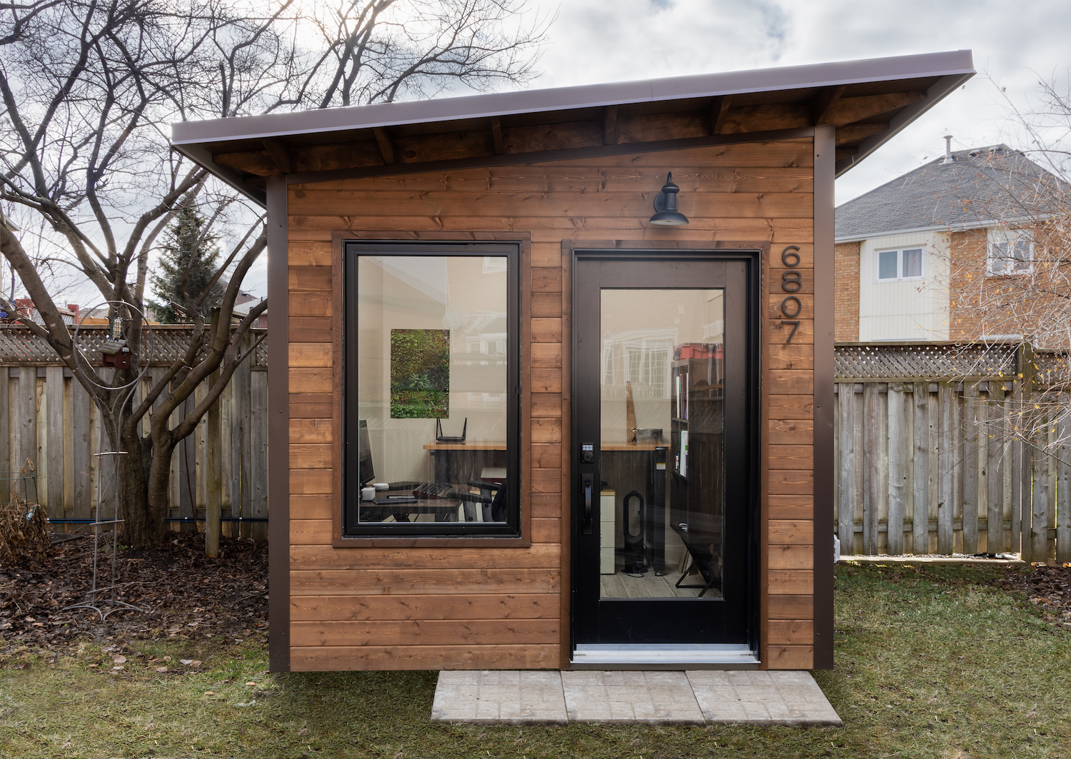 9x9 backyard home office studio with Muskoka Brown pine shiplap siding and Coffee Brown corrugated steel in Mississauga Ontario by Backyard Escape Studios