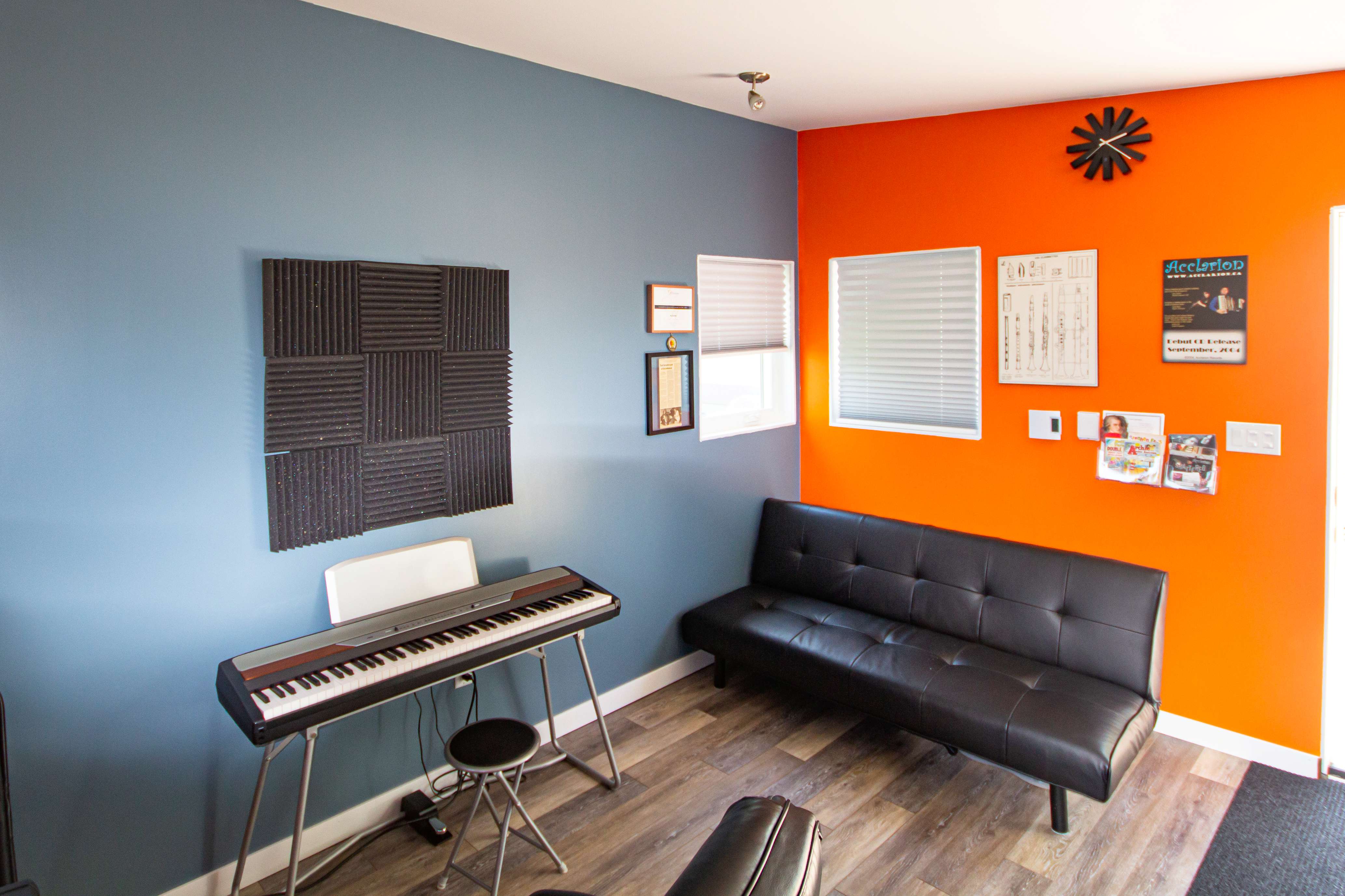 Recording desk with dual monitors and studio speakers inside a 16x12 Music Studio in Windsor, Ontario, installed by Backyard Escape Studios.