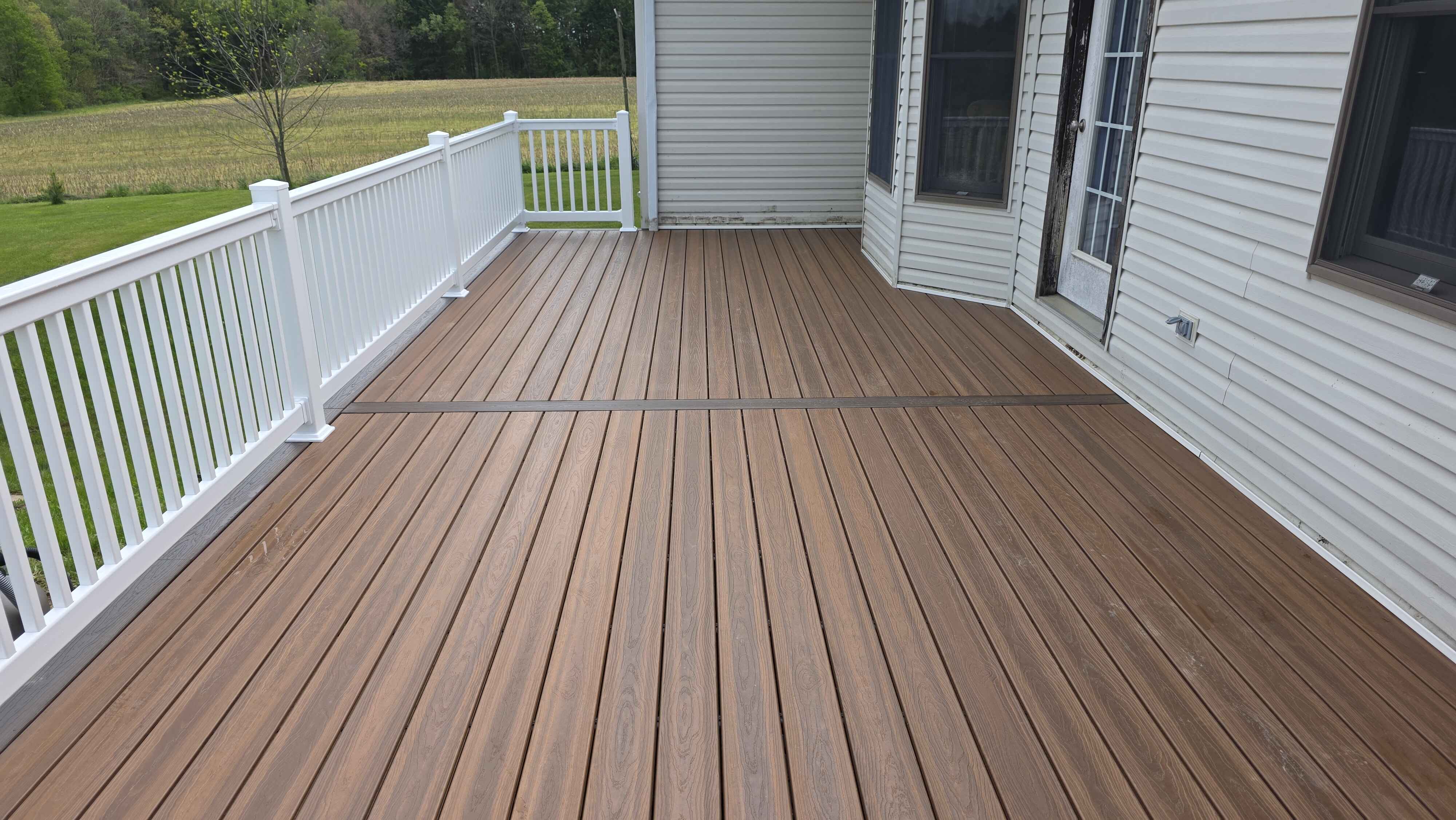 deck building company deck with mixed composite colors