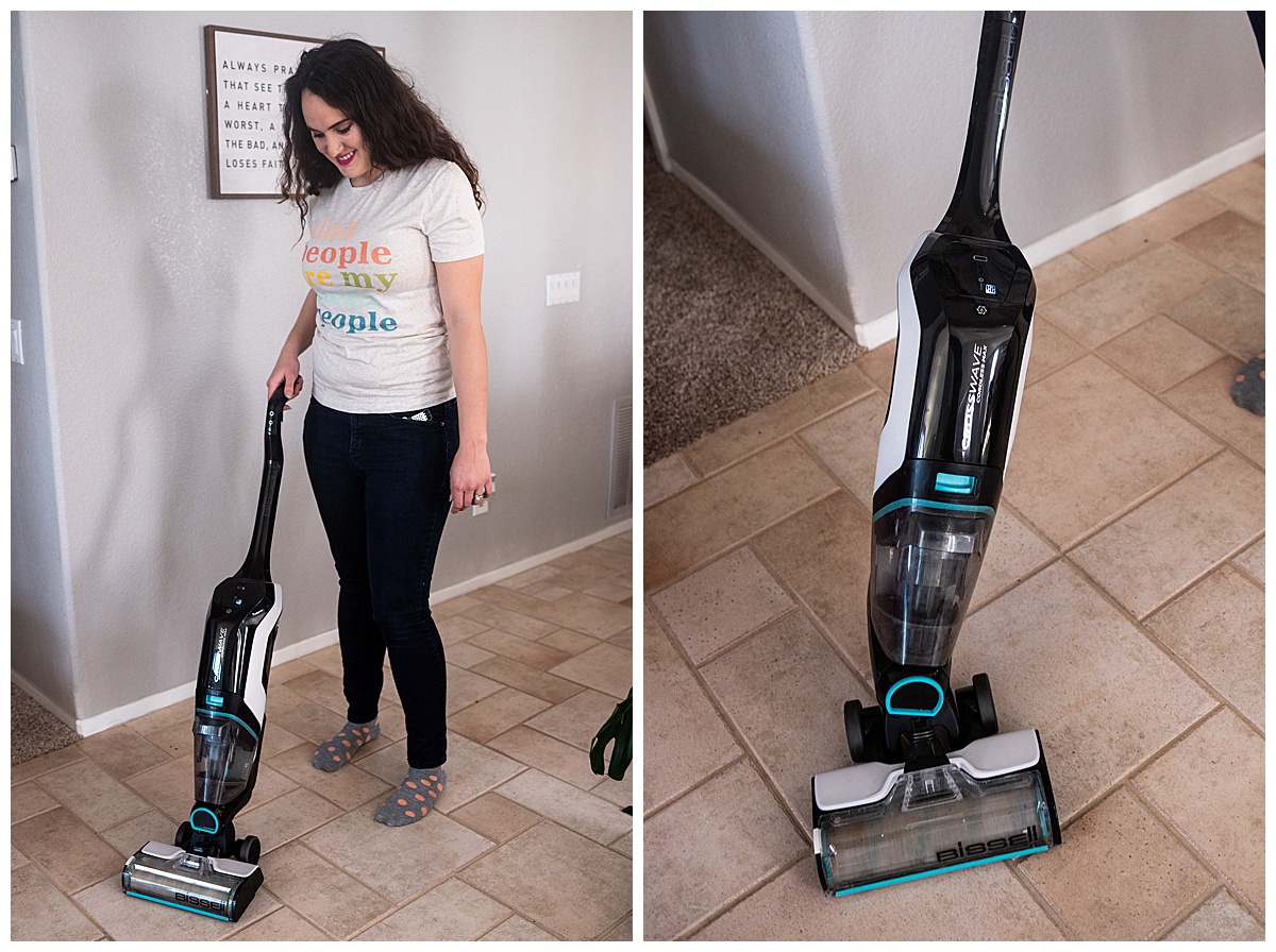 a woman holding a vacuum