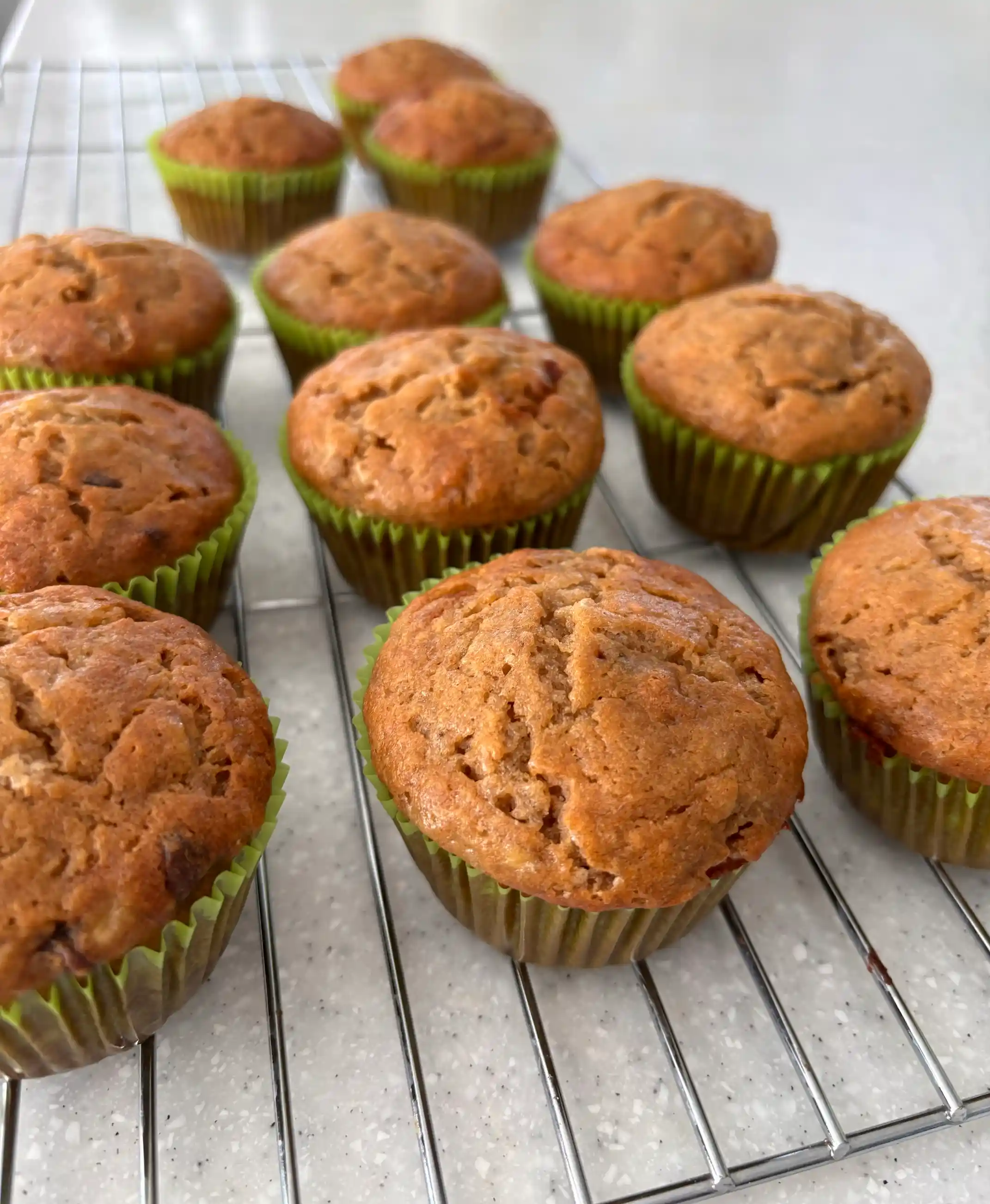 a group of muffins on a cooling rack