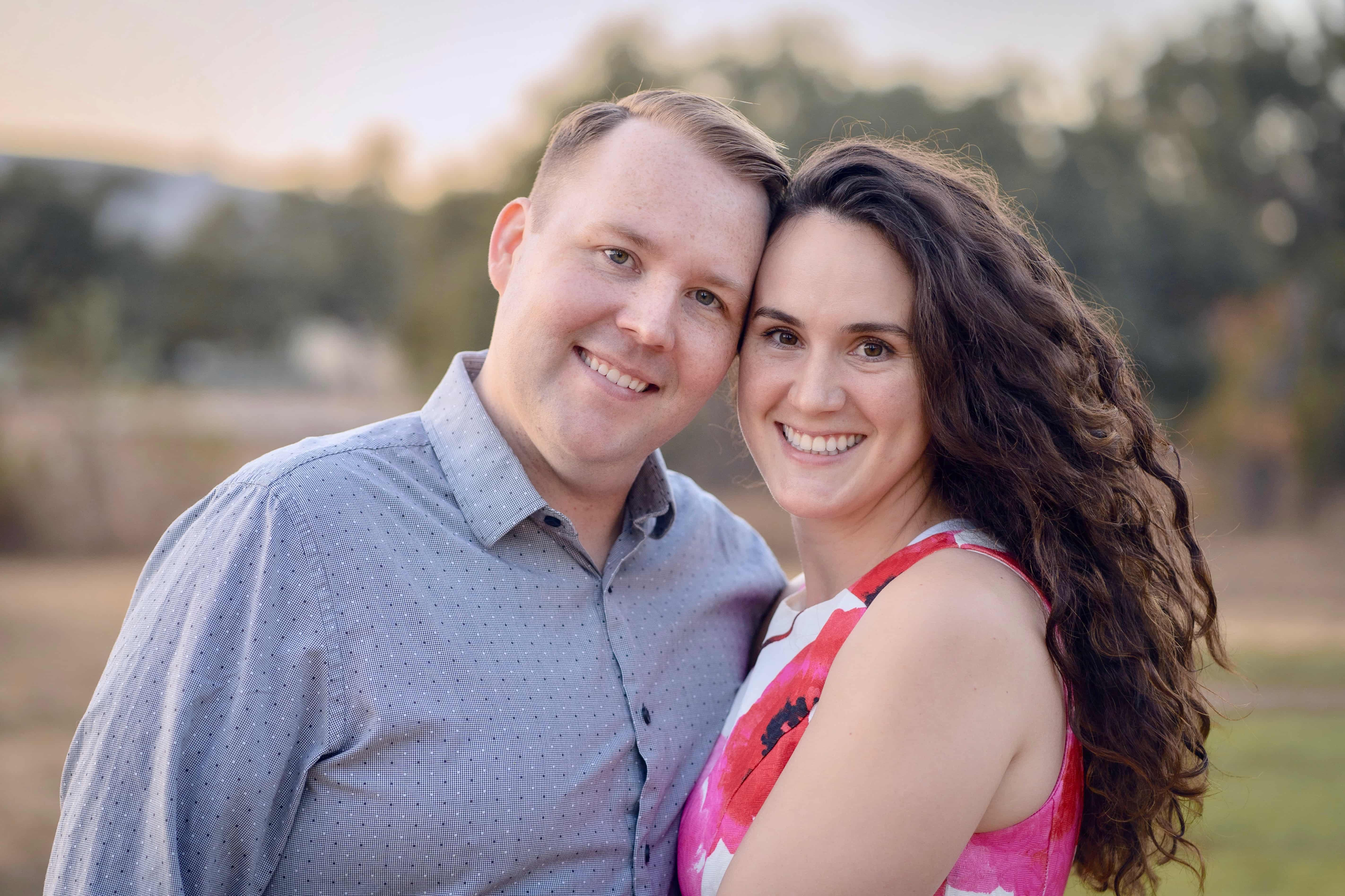 a man and woman smiling for a picture