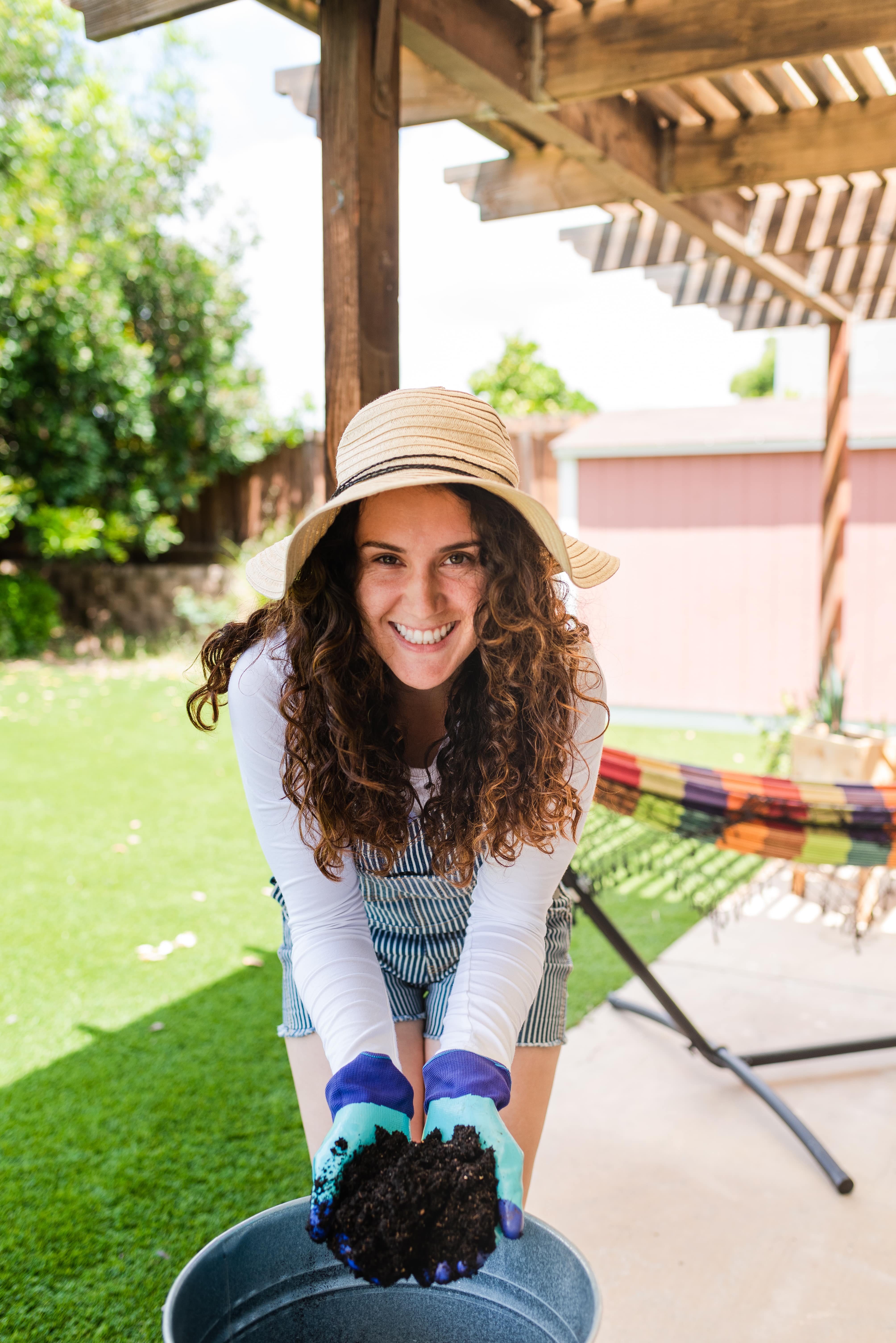 a woman wearing a hat and gloves