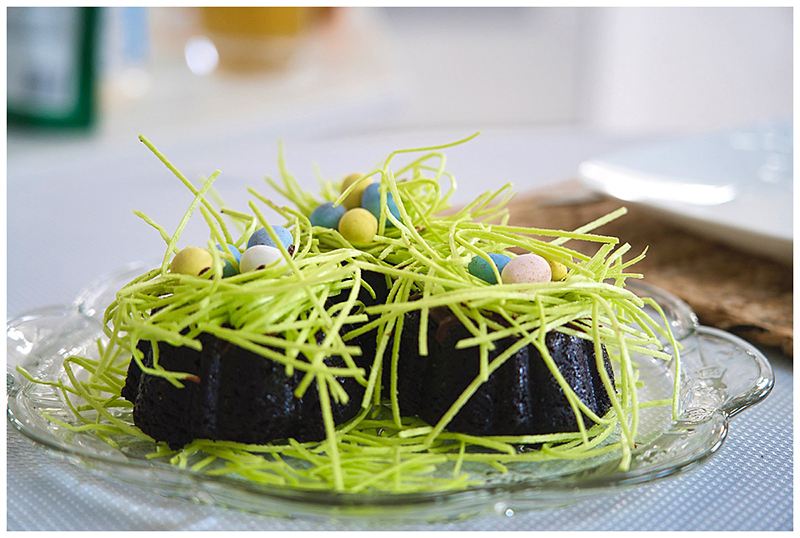 a plate of food with grass and candy on it