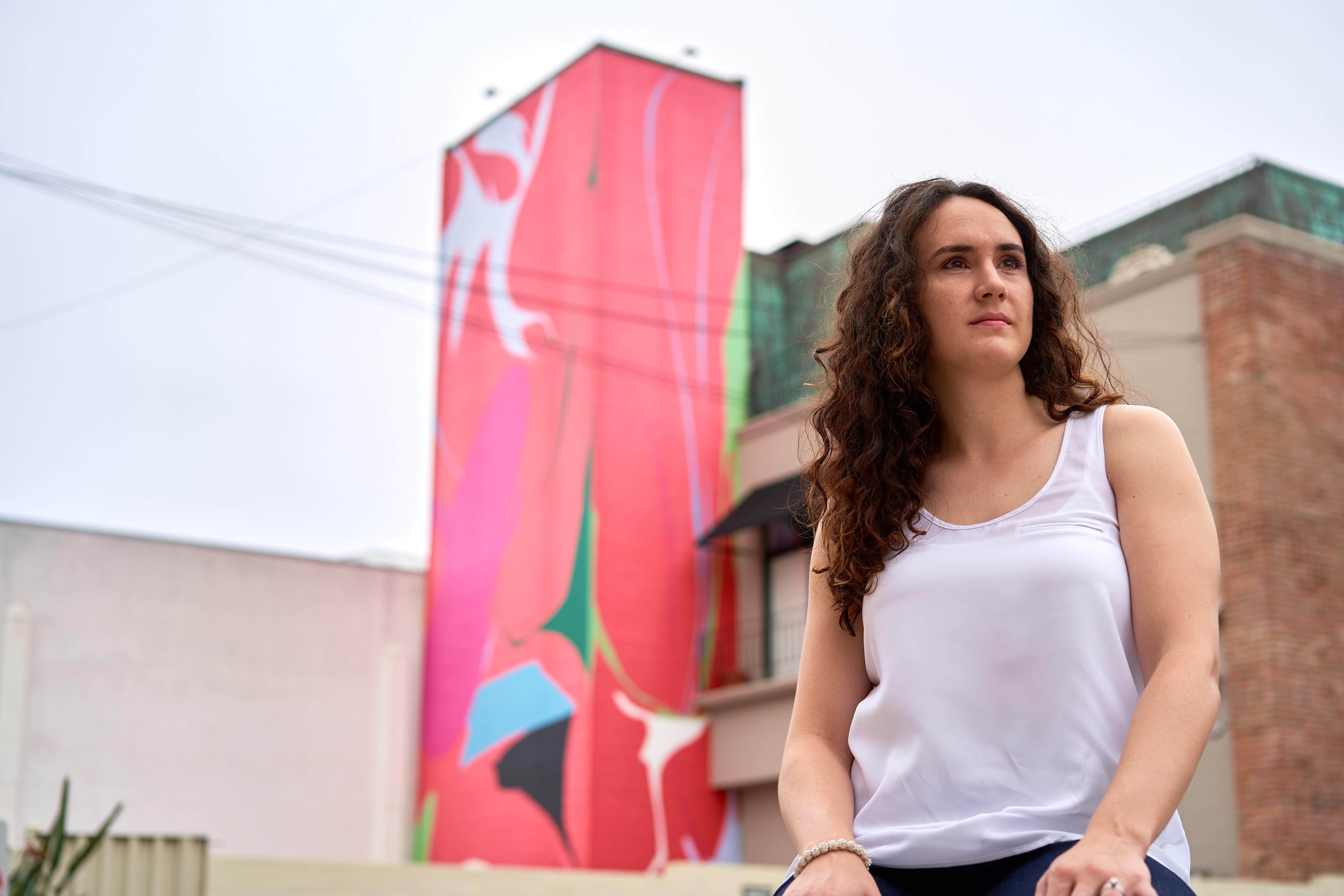 a woman sitting on a bench