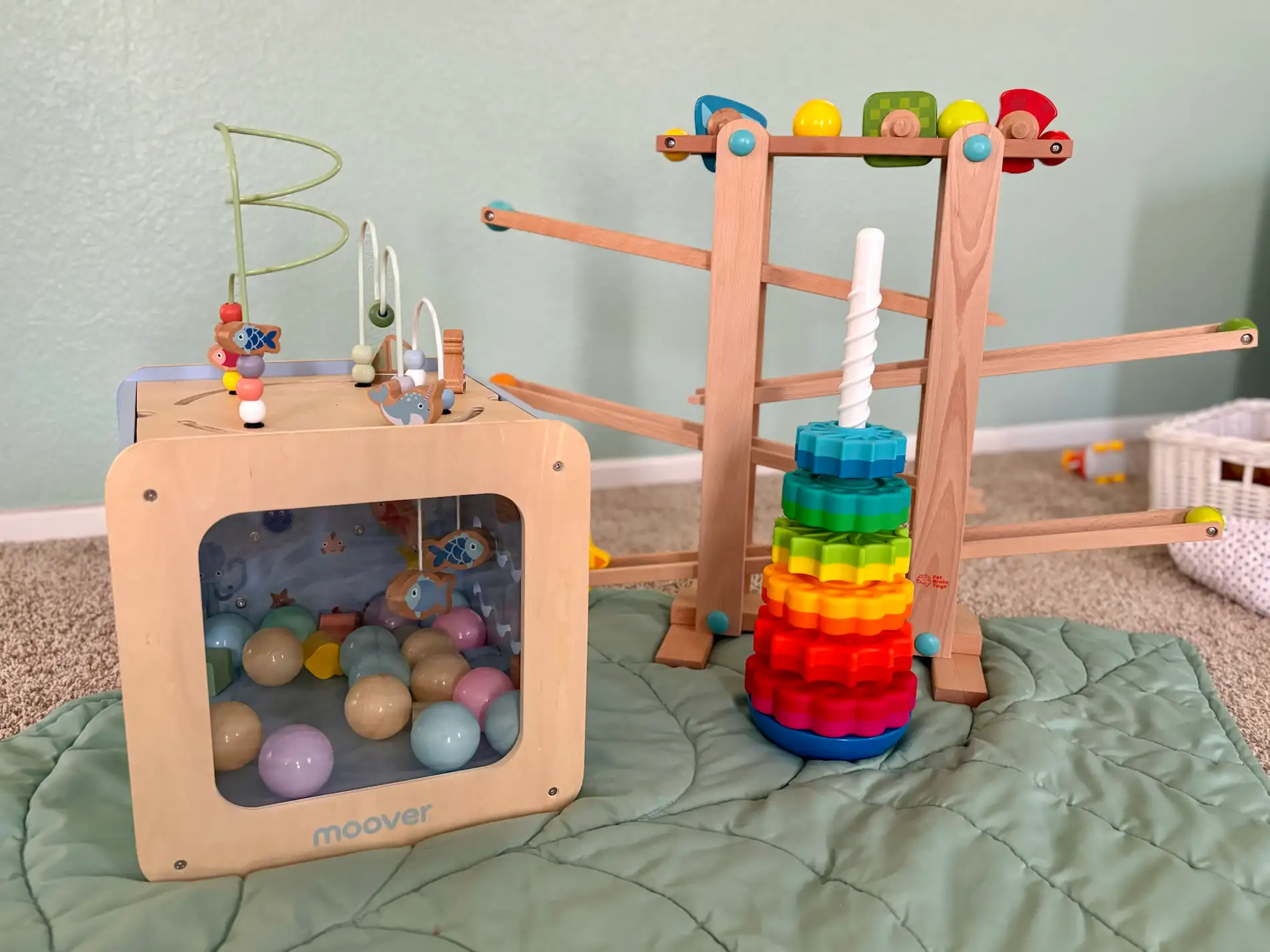 a wooden toy on a blanket