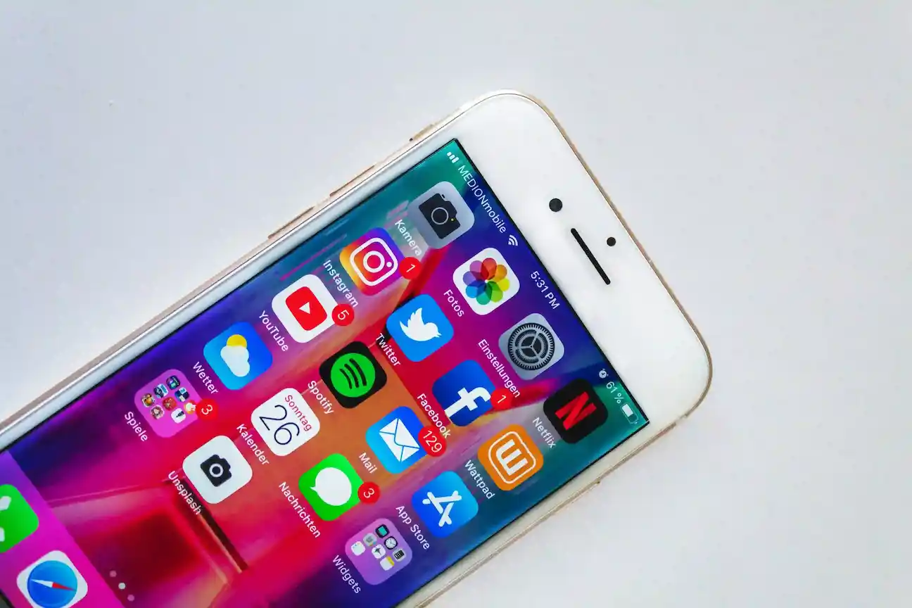 a white cell phone with colorful screen