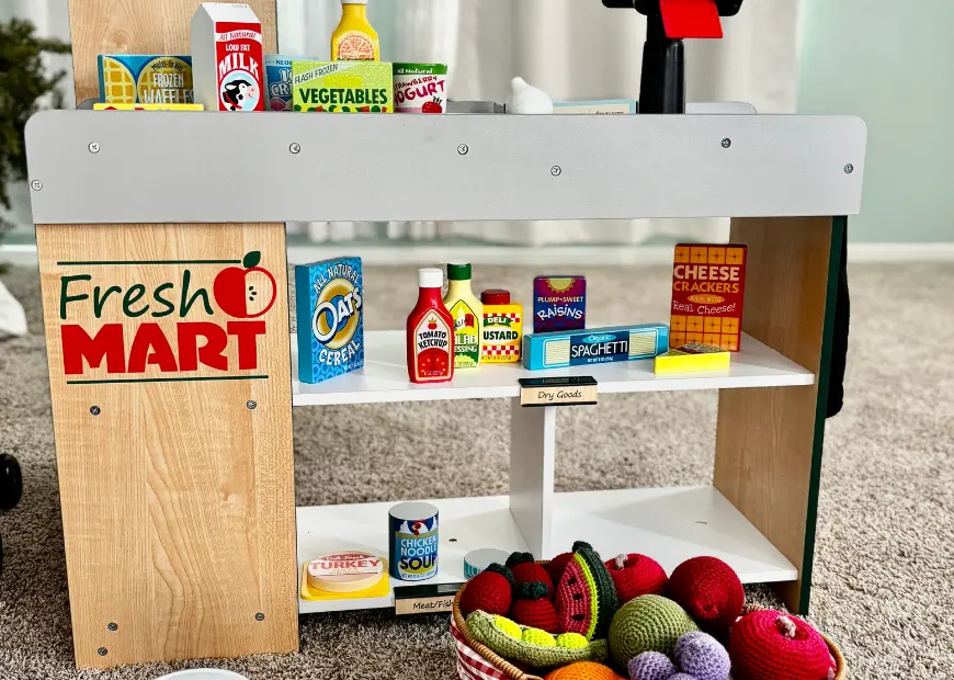 Toy grocery store stand stocked with play food