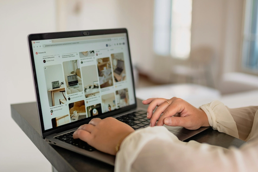Person browsing Pinterest on a laptop