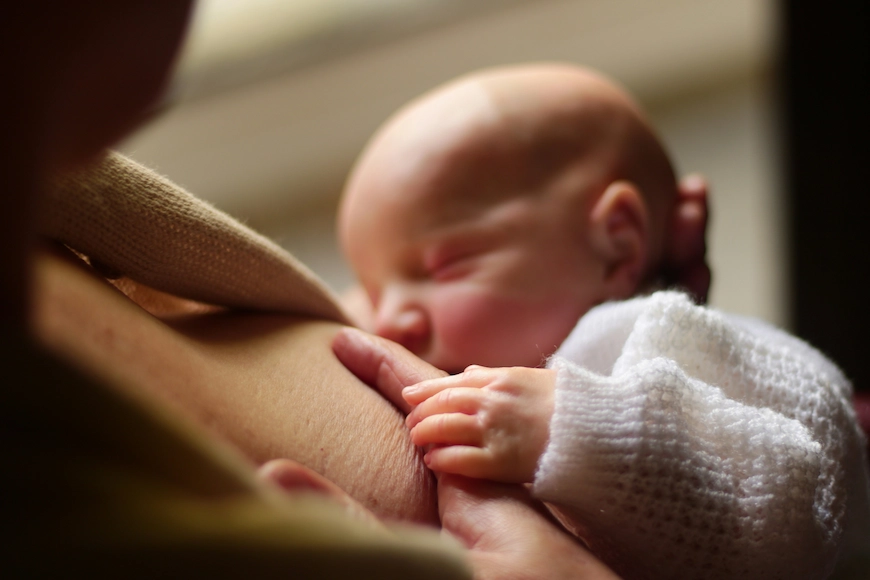 Newborn baby breastfeeding