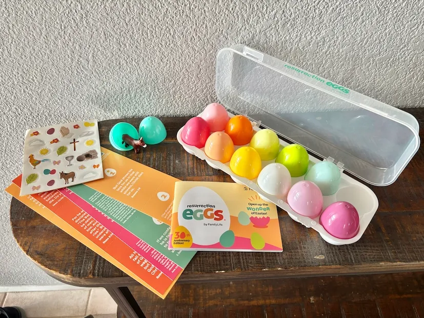 Resurrection eggs in an egg carton next to an Easter storybook