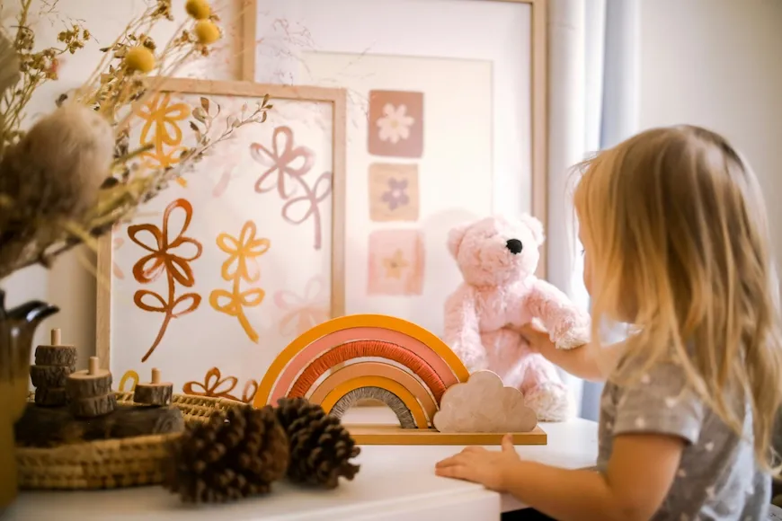 Toddler girl playing in a tidy, organized playroom
