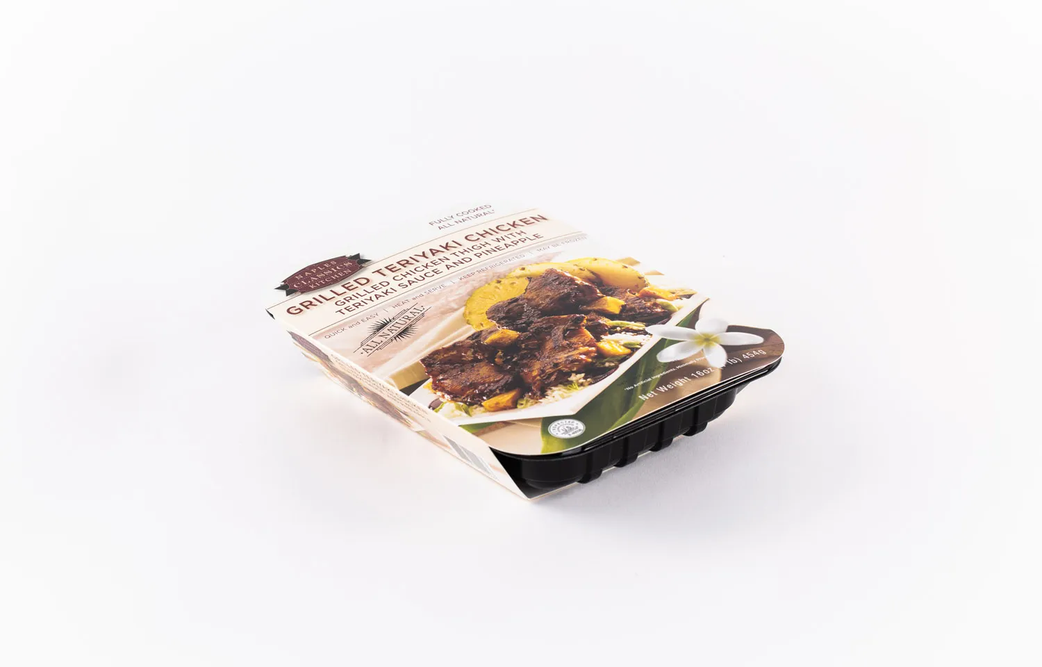Thermoformed meal tray with printed sleeve for grilled teriyaki chicken