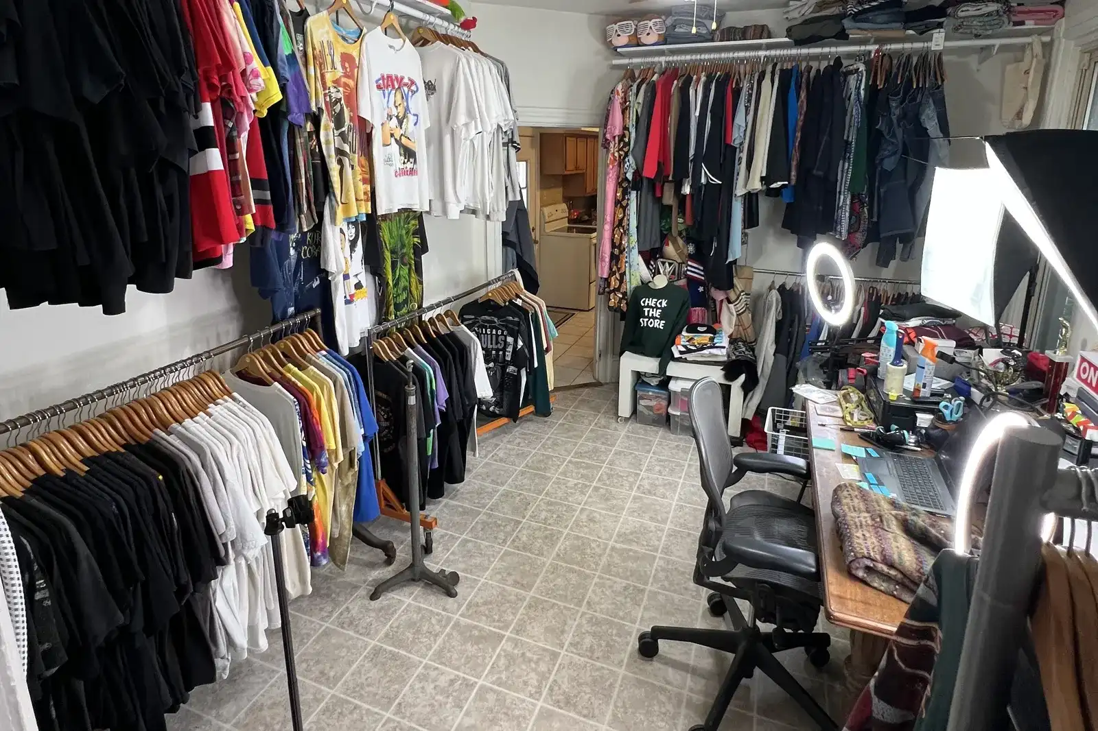 Retroriginal's shop room with racks of vintage t-shirts and a listing desk