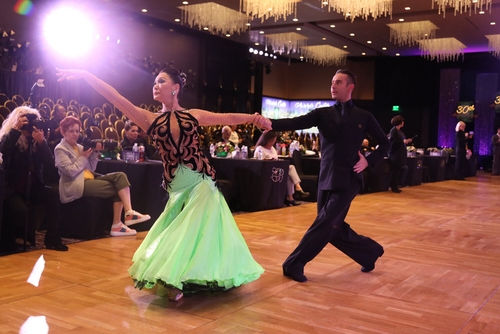 a picutre of atanas malamov and a student dancing at Emerald Ball