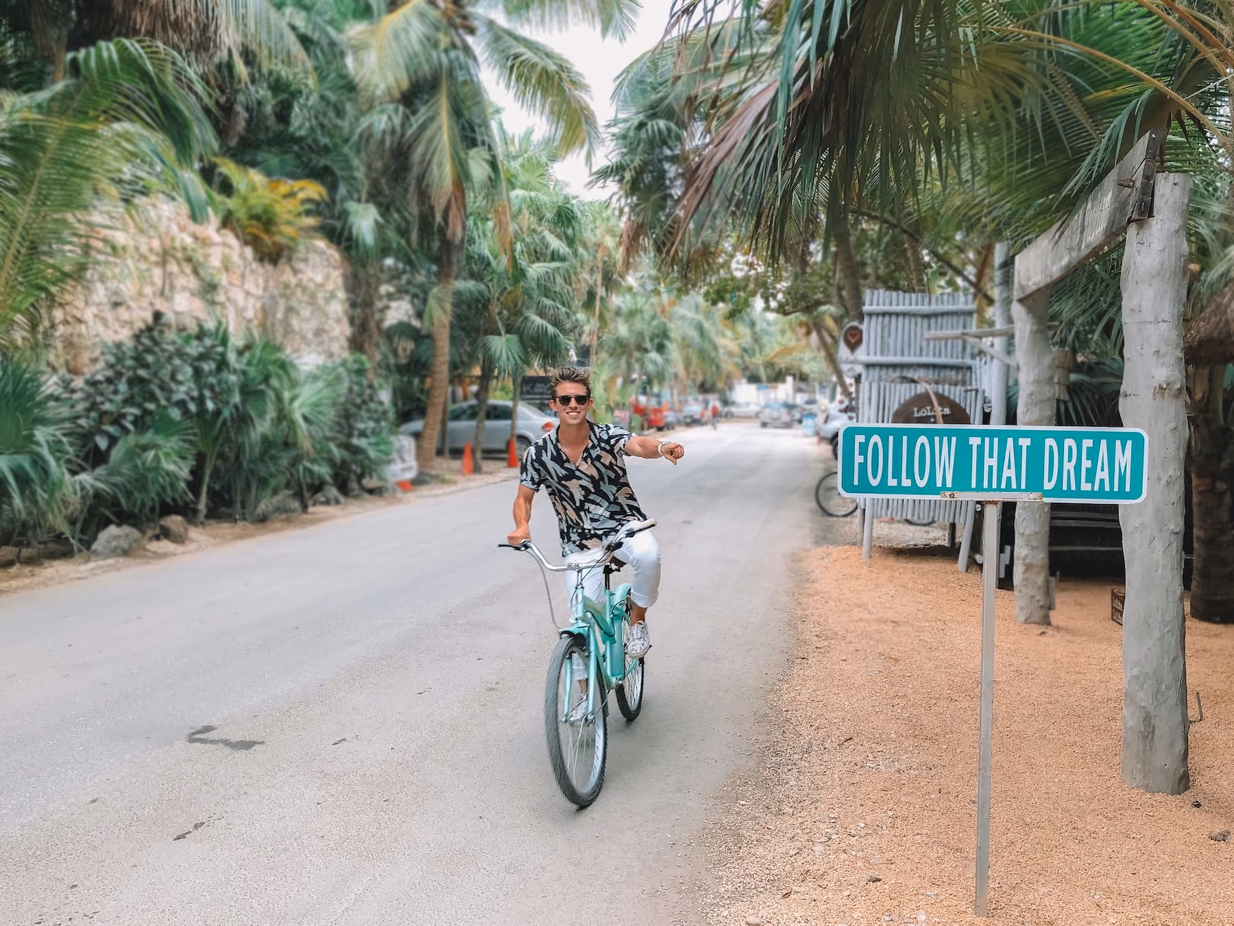 Cyclist riding through Tulum, Mexico