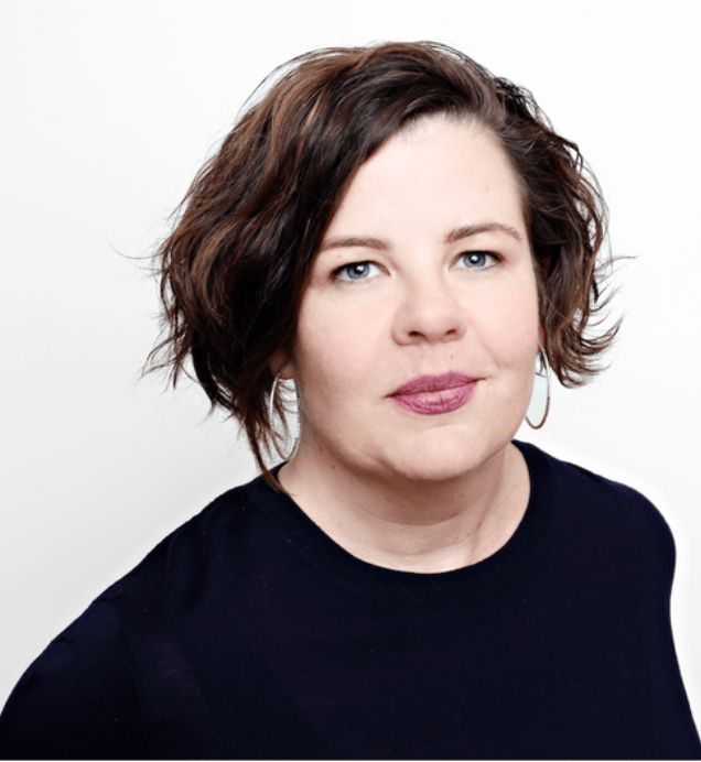 Etoile Stewart, Governance & Advocacy — Person with short wavy hair and hoop earrings wearing a navy top, against a white background