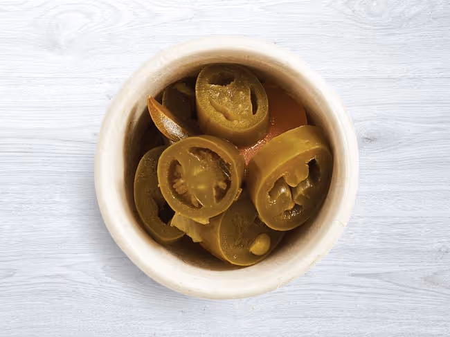 Extra pickled jalapeño side in a dish