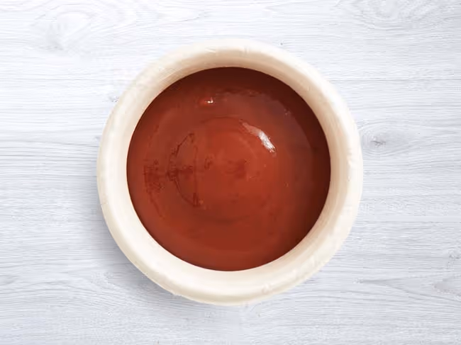 Ketchup side in a dish