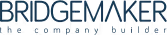 White logo of the company Bridgemaker