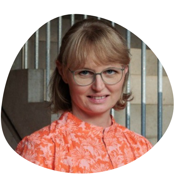 Portrait of Rick Zedník, the General Manager of Lie Detectors. He has dark hair, wears a suit and tie, glasses and smiles into the camera