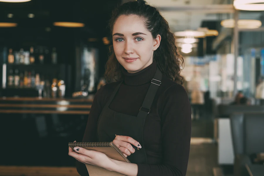Server taking an order during a busy service