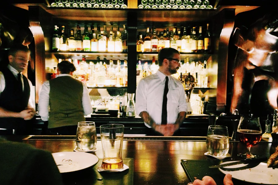 Bartender working a late shift behind the bar