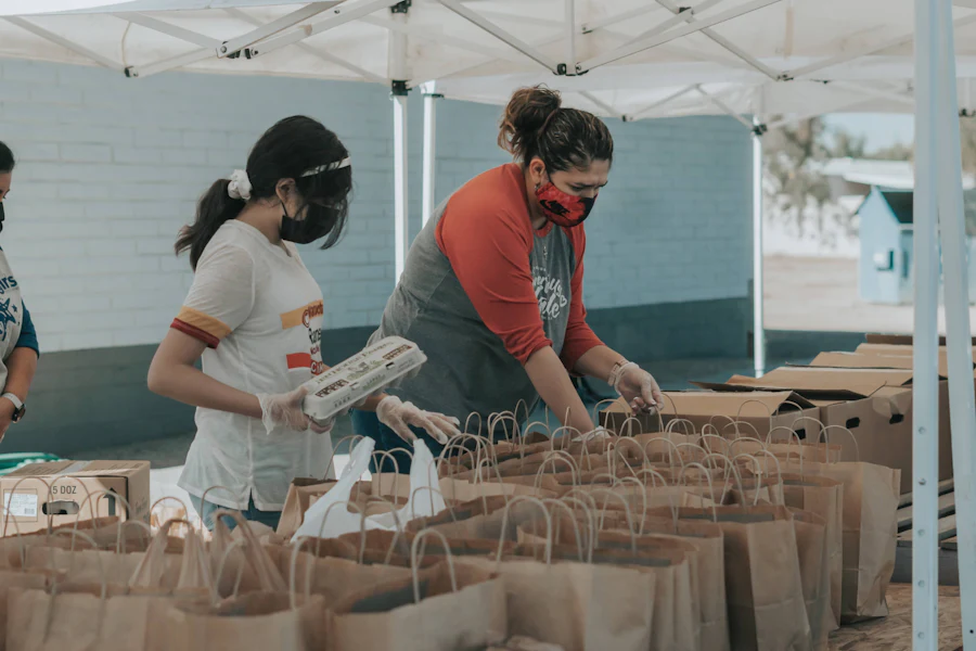 Volunteers packing food parcels at a community event