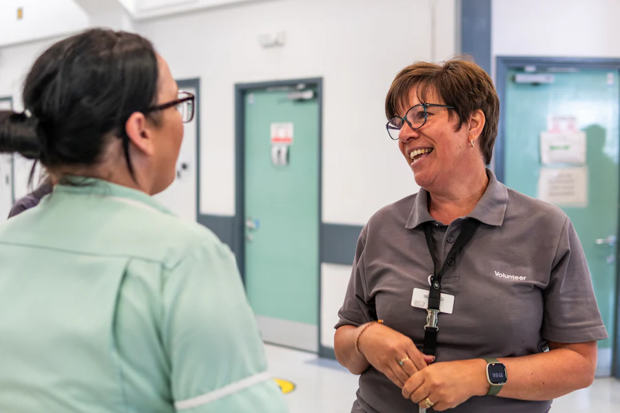 Two colleagues talking in a public service building