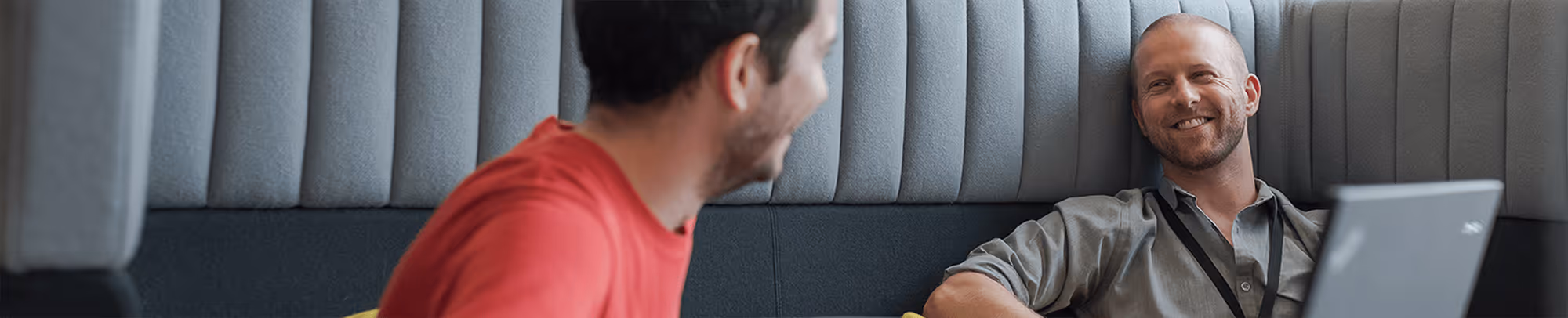 Two men sat in meeting