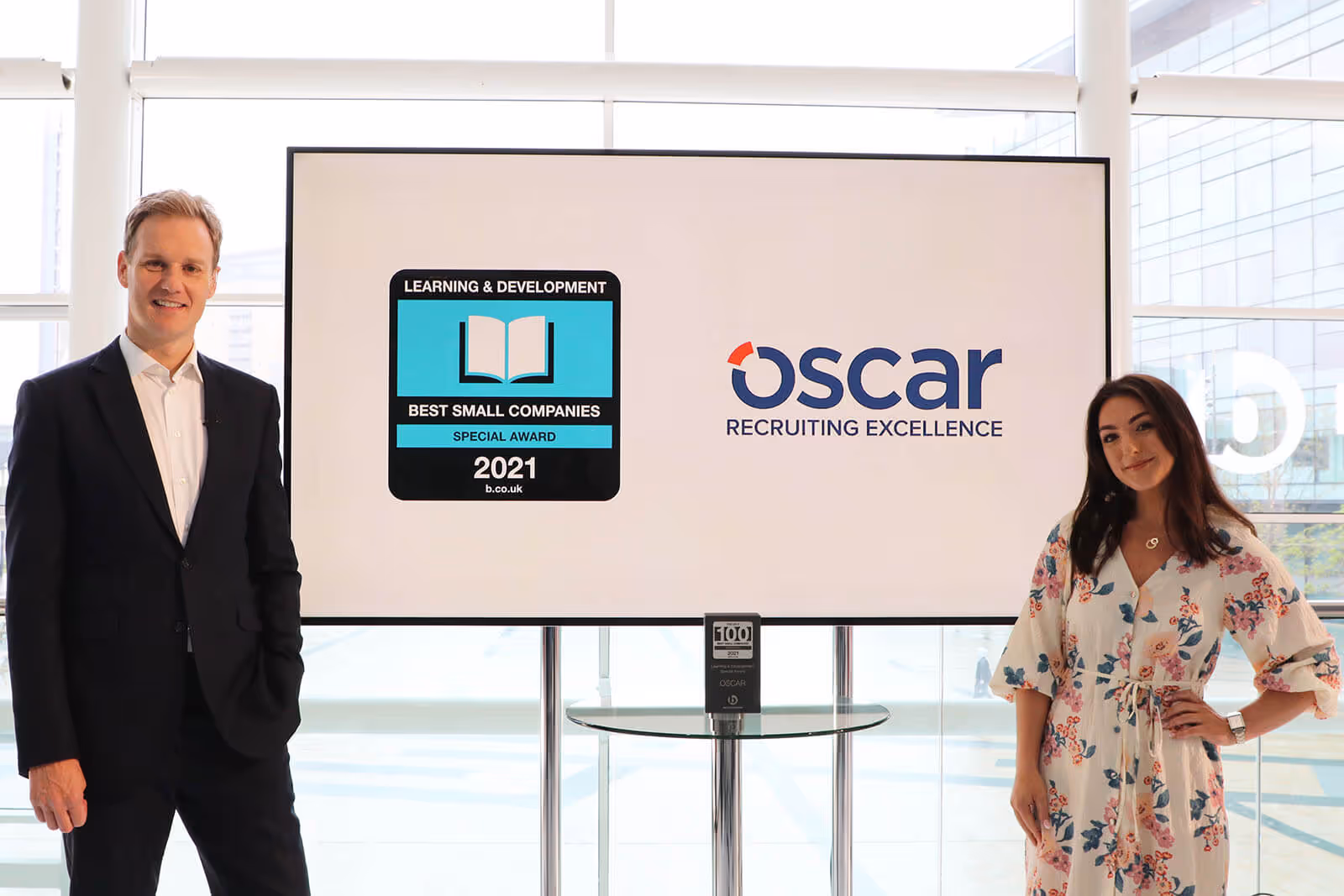 TV presenter Dan Walker with Melanie Sedgley Head of People and Culture at Oscar and the Learning and Development Special Award at Best Companies Live