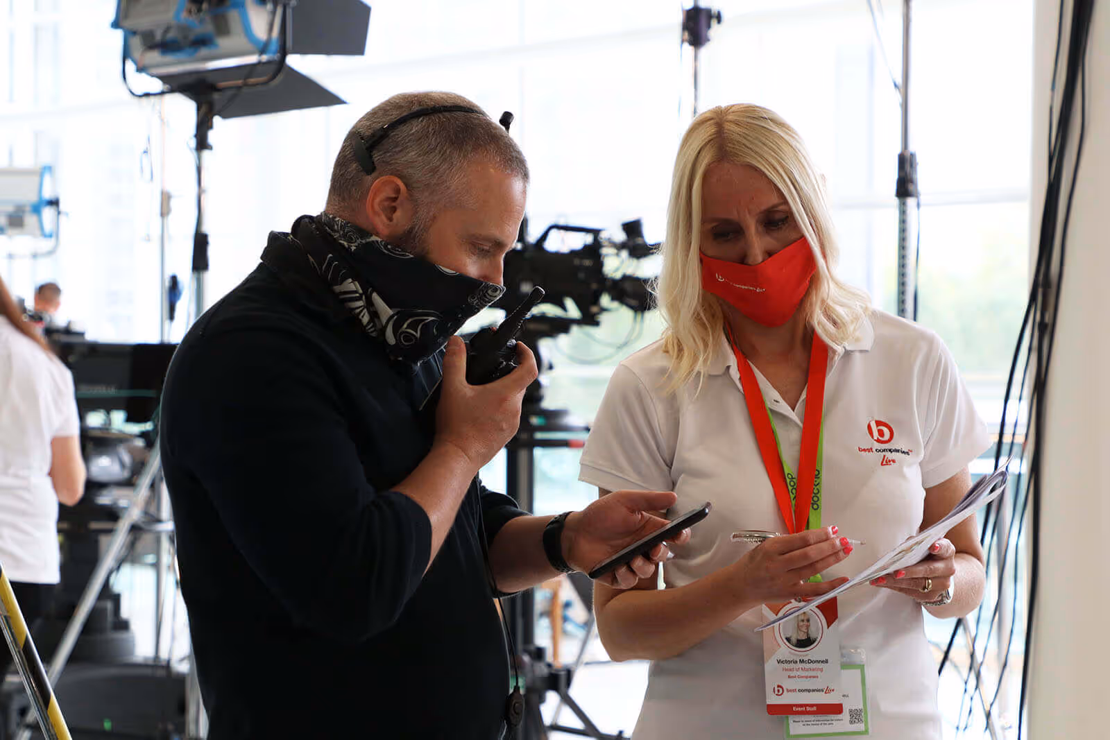 Best Companies Head of Marketing Victoria Mcdonnel behind the scenes with a member of the event staff at Best Companies Live