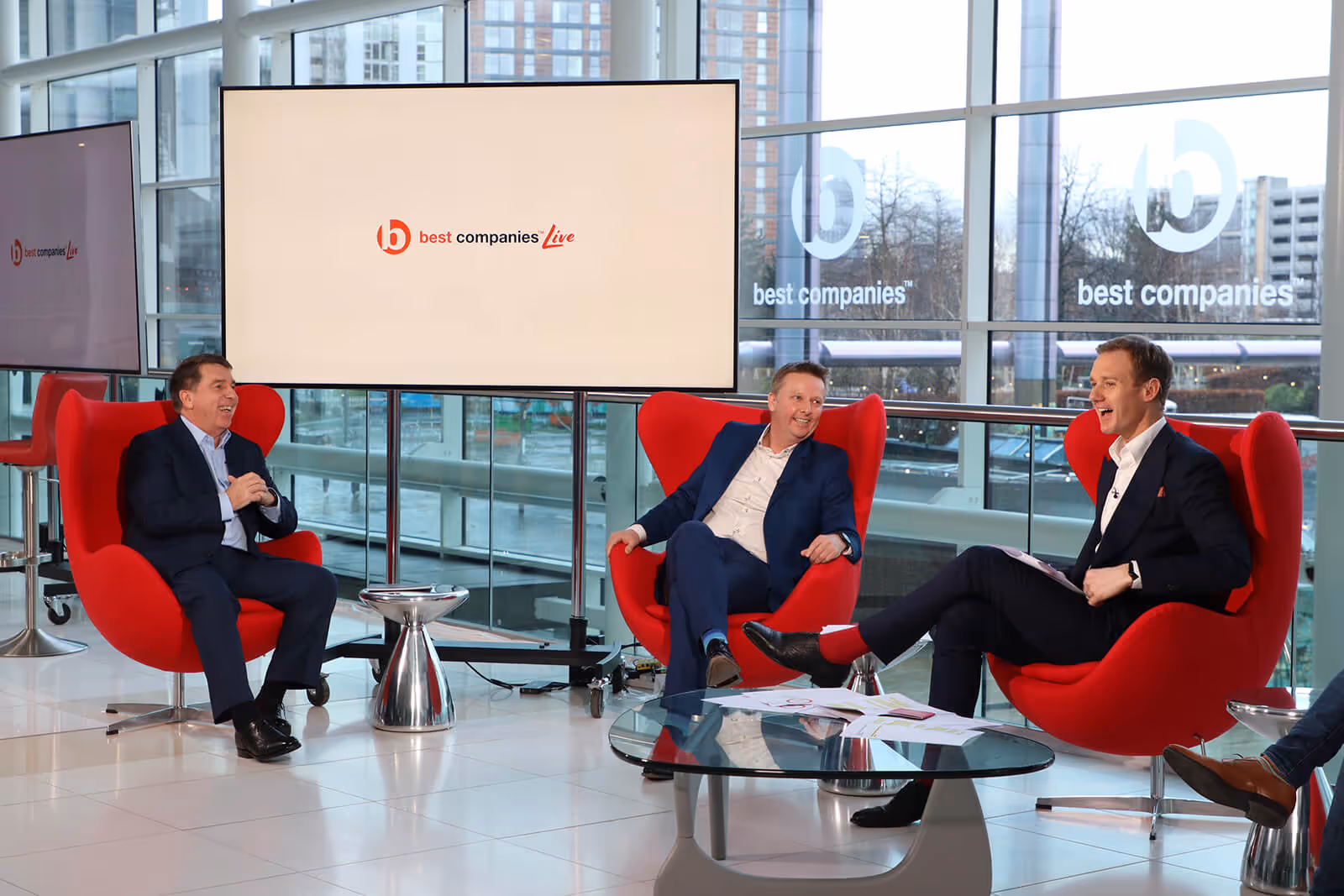 Inspired Villages Lawrence Cramer, Clarion's Roger Hutton and presenter Dan Walker onset at Best Companies Live